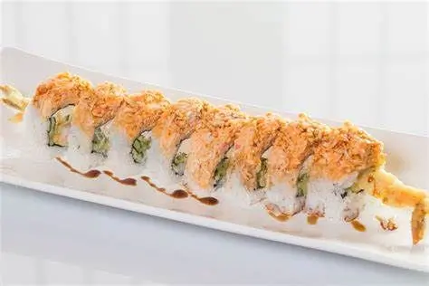 Sushi roll featuring tempura shrimp, cucumber, avocado, and a crispy topping at Sushi Heaven, a Japanese restaurant in Saratoga