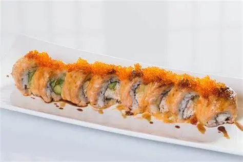 Sushi roll with salmon, avocado, and a crispy topping, drizzled with sauce at Sushi Heaven, a Japanese restaurant in Saratoga